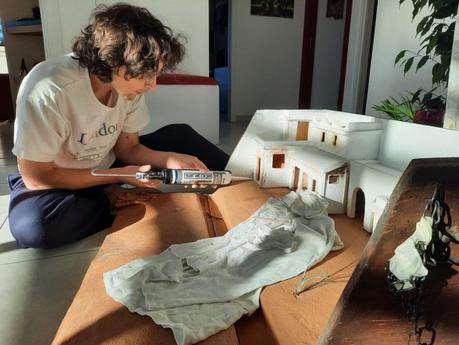 Making a Nativity diorama inside an antique steamer trunk: fixing the buildings in place