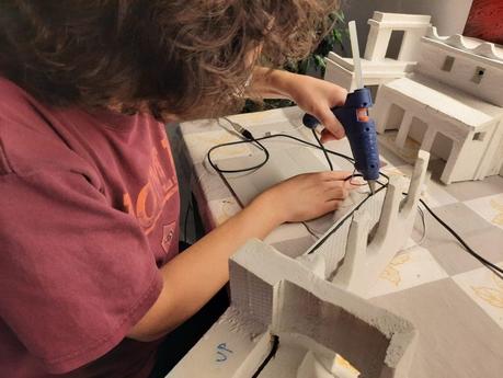 Making a Nativity diorama inside an antique steamer trunk: adding the LED lights to the buildings