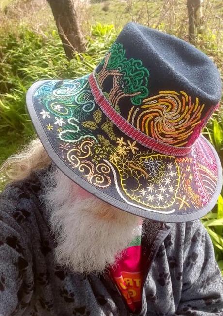 Owen Kelly wearing a hat he embroidered