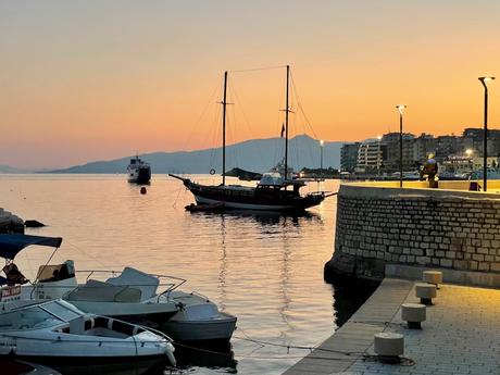 Incredible Places To Visit In Albania sailing-boat-at-sunset-in-saranda-harbour