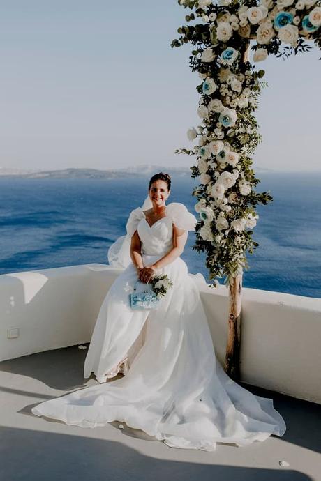 Summer Wedding In Oia With A Lush Floral Arch