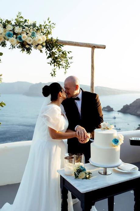 Summer Wedding In Oia With A Lush Floral Arch