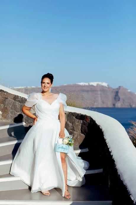 Summer Wedding In Oia With A Lush Floral Arch