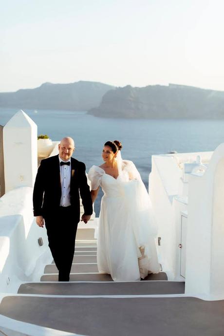Summer Wedding In Oia With A Lush Floral Arch