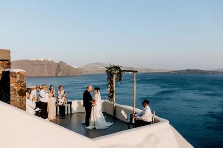 Summer Wedding In Oia With A Lush Floral Arch
