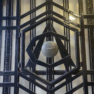 Mysterious metalwork quiz: answers Photo showing patterned metalwork with a ball and a monogram, AC, in the center.