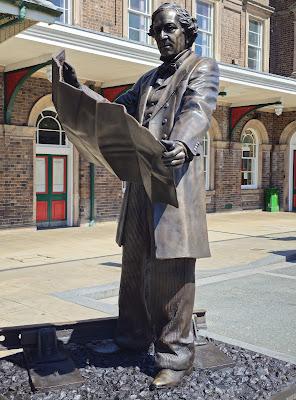 Chester's newest statue: Thomas Brassey Full-length view of Brassey's statue: he is consulting a map, and placed in front of the station building.