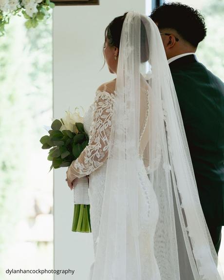 An Emerald & Sage, Zero-Alcohol Real Wedding bride and groom standing close gazing at each other during ceremony dylanhancockphotography