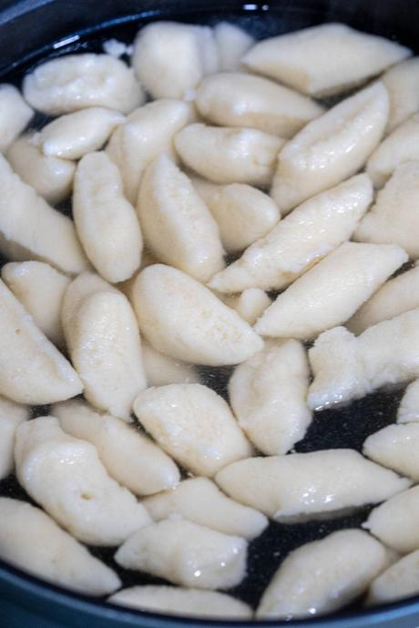 boiling gnocchi floating in a pot