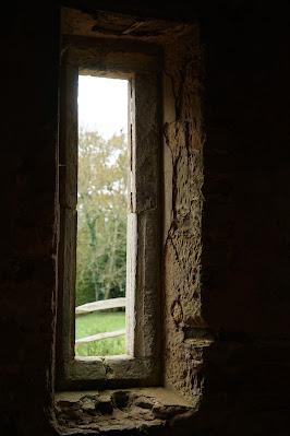 Weathered and worn: Battle Abbey's stones Photo of a narrow window. The stone around it is worn and flaked, with a deep dip worn into the sill.