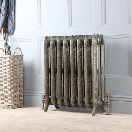 8 radiator ideas for period properties Milano Beatrix antique brass ornate cast iron radiator on light wall nearby basket