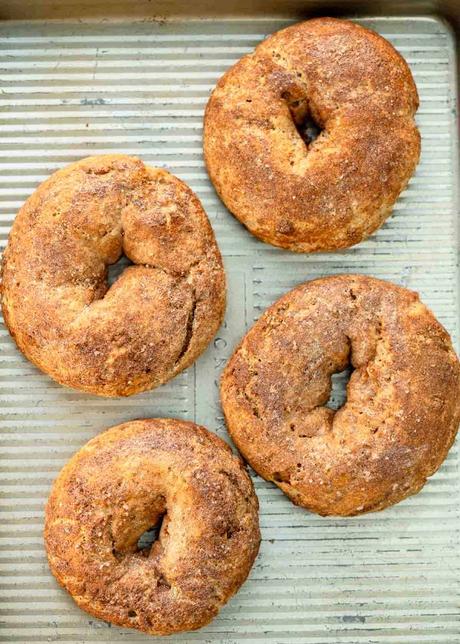 cooked cinnamon bagels on sheet pan