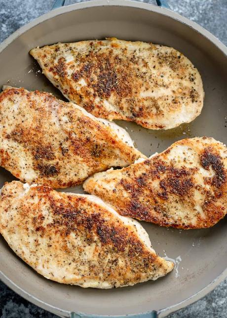 pan seared seasoned chicken in a skillet