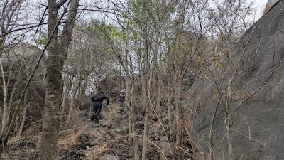 Sippy and Bhai going past the first fort wall at Acchalu, Ramanagara
