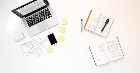 A carefully arranged flat-lay composition on a clean white surface featuring ess