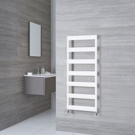 Milano Passo white aluminum designer towel rail on light gray wall in bathroom around the corner from anthracite floating sink with drawer beneath rectangular mirror