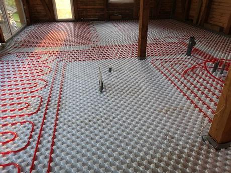 Underfloor heating red wiring on floor before flooring is laid on top