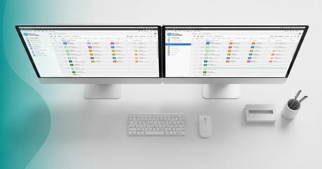 An elegant overhead shot of a sleek desktop setup showing dual monitors displayi