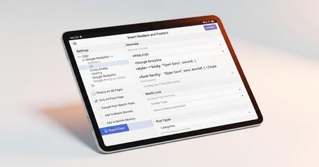 Close-up view of tablet device displaying WordPress admin area with Insert Heade