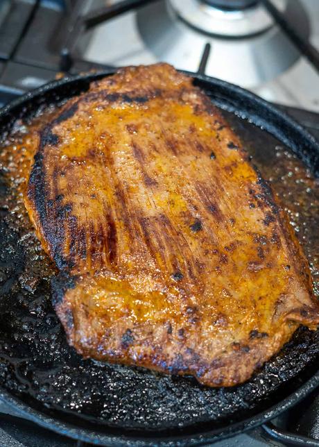 Carne Asada Tacos cooked carne asada in cast iron skillet