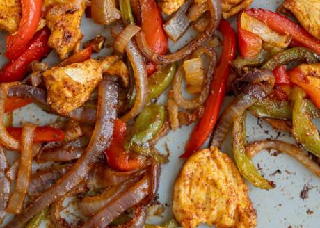 cooked fajita ingredients on a sheet pan