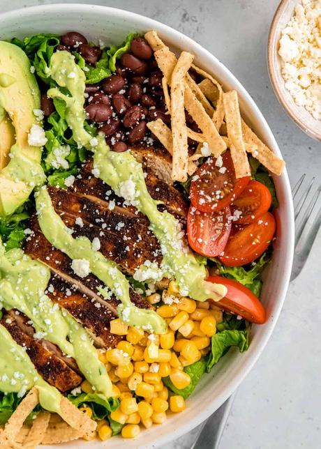 close, overhead image of a southwest chicken salad in a white bowl