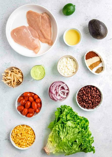 southwest chicken salad ingredients on a white table