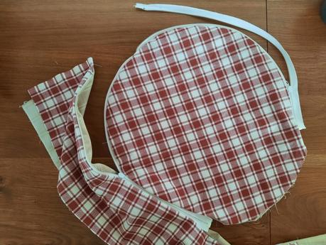 Starting to attach the wrapping strip to the circles to make my bodhran bag