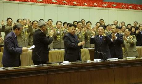 Kim Jong Un applauds at the conference.  Also seen in attendance on the rostrum are Choe Tae Bok (L), Kim Ki Nam (2nd L), Kim P'yo'ng-hae (3rd R), Kwak Pom Gi (2nd R) and Col. Gen. Kim Chang Sop (R) (Photo: Rodong Sinmun).