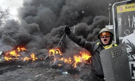 A protester in Ukraine swings a metal chain during clashes - a taste of things to come? Photograph: Gleb Garanich/Reuters