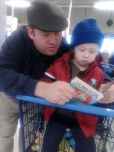 Practicing letter recognition in the grocery store checkout.