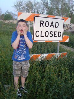 In the end, we all become stories - Samuel with the Road Closed sign