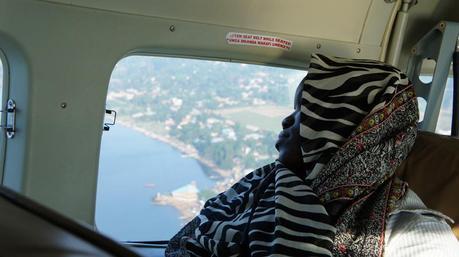 Lady sleeping on plane. Aerial view of Entebbe. Entebbe to Kisoro with Aerolink. domestic flights uganda