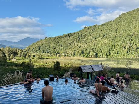 Visitors bathing in outdoor thermal pools at Termas del Sol, outside Río Puelo in Cochamó