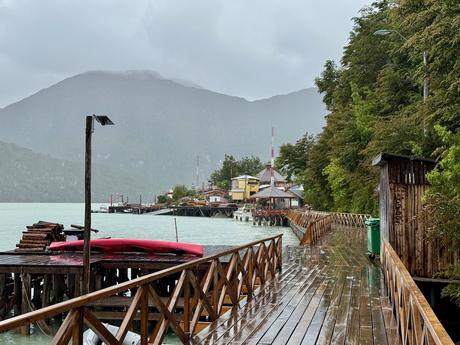 Rain-soaked wooden boardwalk and harbour piers in Caleta Tortel, Chilean Patagonia