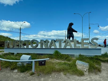 Puerto Natales welcome sign with a mylodon statue at the entrance to the Patagonian town