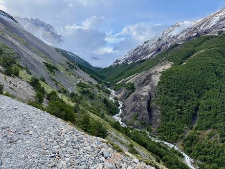 Snowy peaks, forested slopes and a river valley along the trail to Mirador Base Torres in the Chileno sector of Torres del Paine