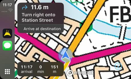 Turn-by-turn navigation on CarPlay over Ordnance Survey mapping, showing the next manoeuvre, arrival time and distance remaining
