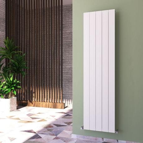 Carisa Monza white aluminum vertical designer radiator on green wall nearby large vertical wooden panelling