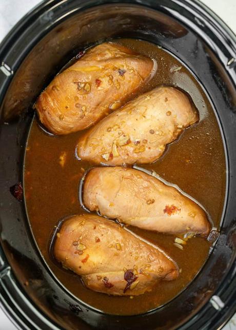 cooked chicken in a slow cooker in honey chipotle sauce