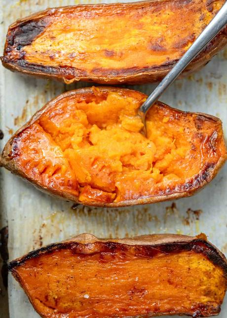 overhead image of a roasted sweet potato with a fork inside of it