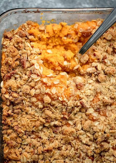 an overhead shot of sweet potato casserole with a spoon