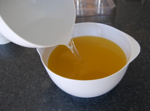 adding lye water to the soaping oils