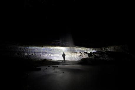 standing in lit cave night lower kalimna falls