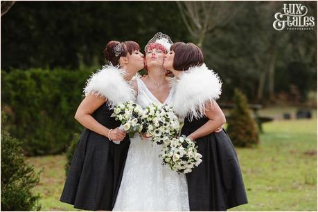Bridesmaids kiss bride at hogarths hotel wedding