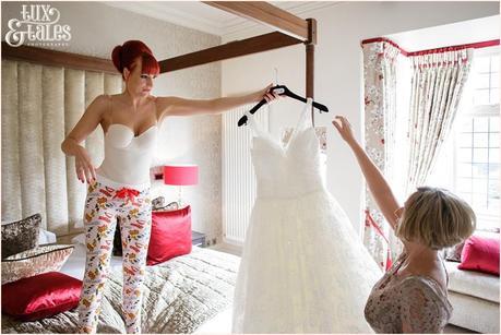 readhead bride holding dress at hogarths hotel 