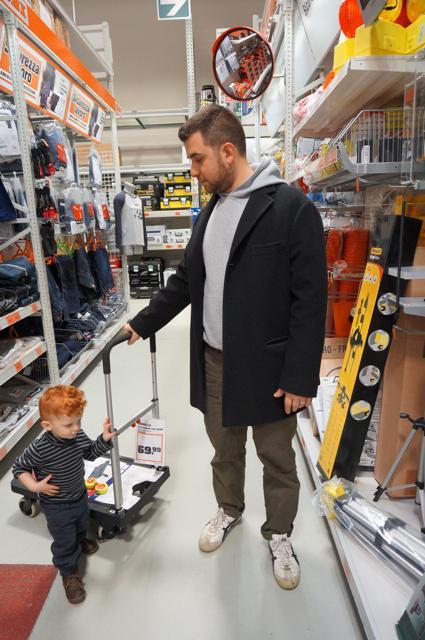 Reasonstodress.com Reasons to Dress Big Box Stores do Exist in Italy Department stores in Italy North American influence on Italian Life OBI - wearing Tiger sweatshirt , over the knee leather boots father and son in hardware store