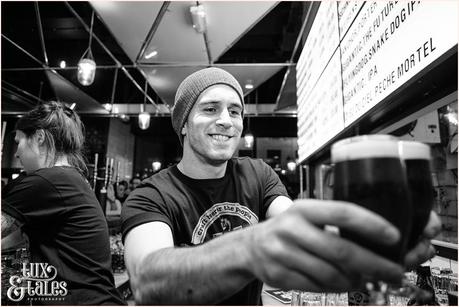 Bartender serves drink at Brew Dog Sheffiled