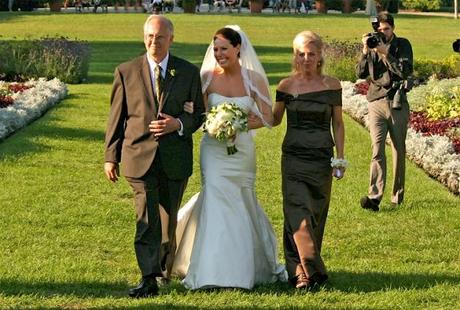 Both parents walking bride down the aisle