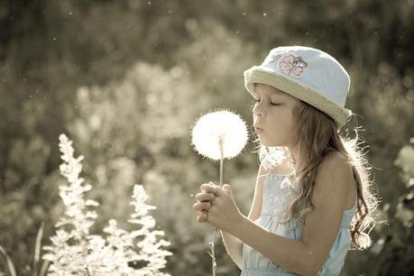 A Cute Little Girl With A Flower